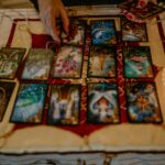 Person engaging in a mystical tarot card reading session, exploring fate and destiny.